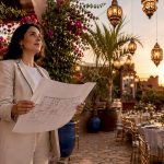 Moroccan female event planner reviewing event layouts