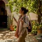 Traveler with offline map app walking Moroccan medina