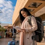 Traveler reviewing documents in Moroccan airport
